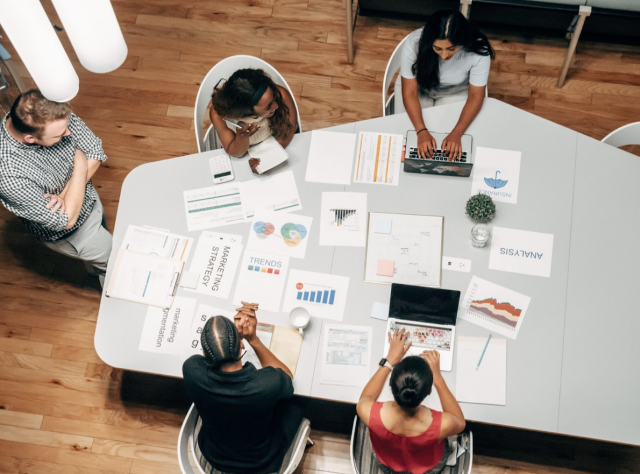 Arial View of People Sitting at a Conference Table